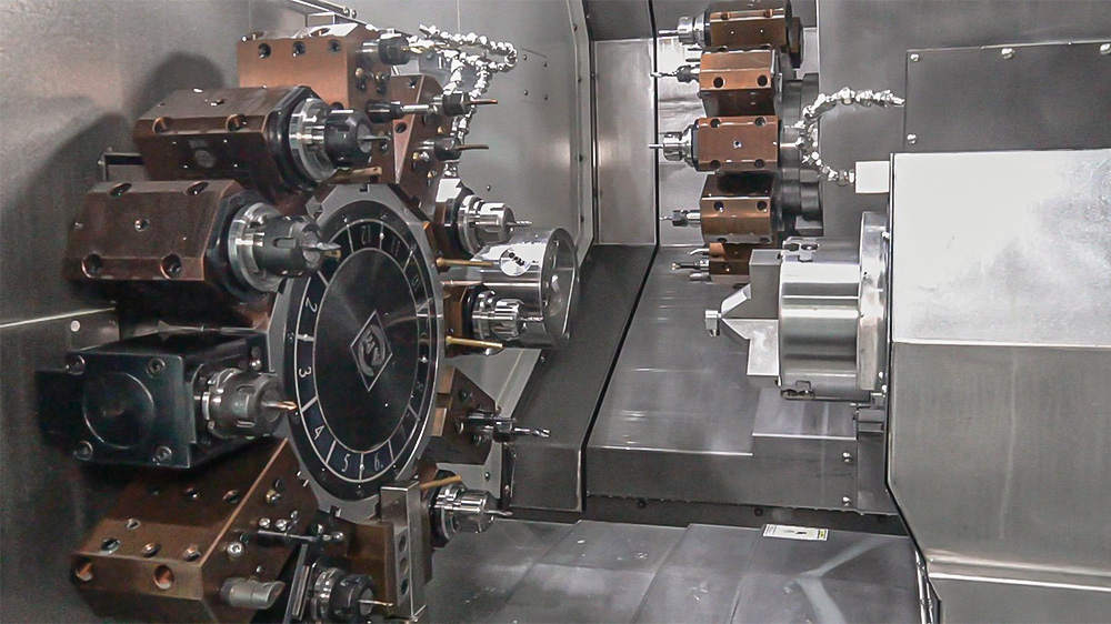 Dual-spindle dual-turret CNC machining center handling a complex metal part Dual-spindle dual-turret CNC machining center handling a complex metal part